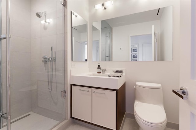 bathroom featuring vanity, toilet, and walk in shower