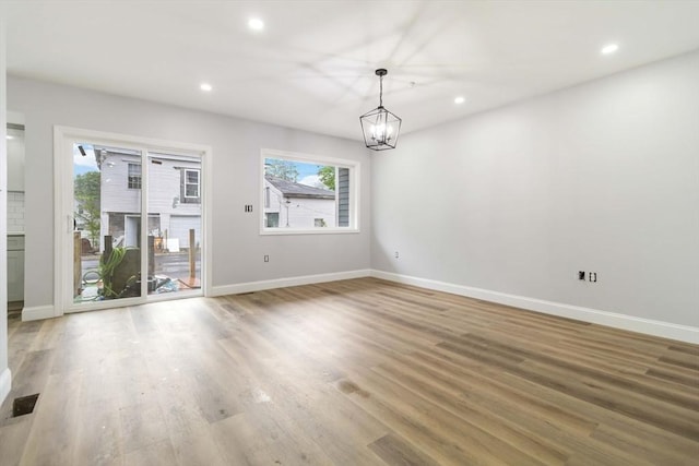 43 Pine St, Taunton, MA 02780 - spare room featuring baseboards, light wood-type flooring, recessed lighting, and a chandelier