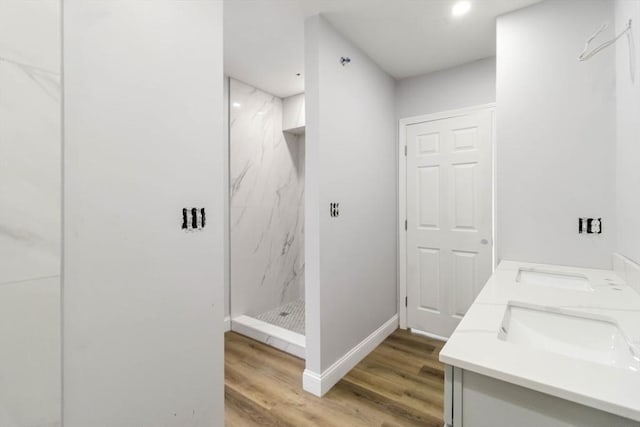 43 Pine St, Taunton, MA 02780 - bathroom with wood finished floors, a marble finish shower, a sink, and baseboards