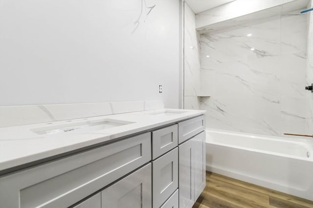 43 Pine St, Taunton, MA 02780 - full bathroom featuring double vanity,  shower combination, and wood finished floors