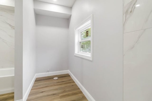 43 Pine St, Taunton, MA 02780 - laundry area with light wood-style floors and baseboards