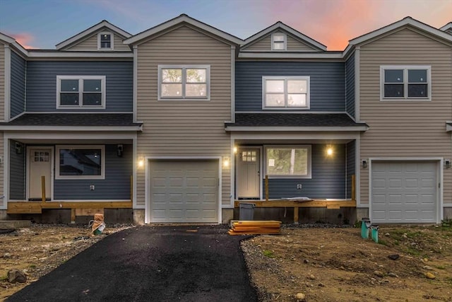 43 Pine St, Taunton, MA 02780 - view of front facade with an attached garage, driveway, and covered porch