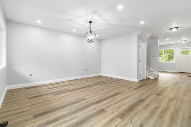 43 Pine St, Taunton, MA 02780 - empty room with recessed lighting, stairway, baseboards, light wood-type flooring, and a chandelier