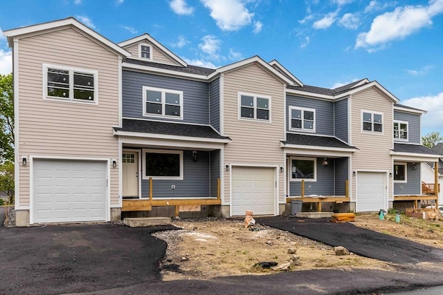 43 Pine St, Taunton, MA 02780 - view of front facade featuring driveway, roof with shingles, and an attached garage