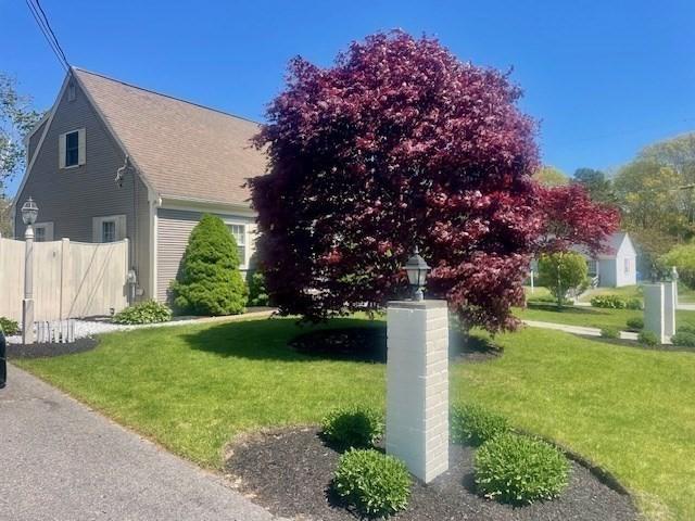 2 Spinning Brook Rd, Yarmouth, MA 02664 - view of side of property featuring a shingled roof