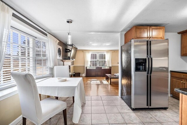 2 Spinning Brook Rd, Yarmouth, MA 02664 - dining room with light tile patterned floors and baseboards