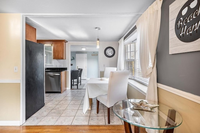 2 Spinning Brook Rd, Yarmouth, MA 02664 - dining space with baseboards and light tile patterned floors