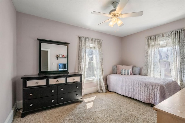 bedroom featuring carpet floors, a ceiling fan, and baseboards