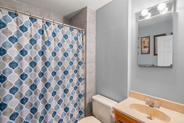 bathroom with vanity, a shower with curtain, and toilet