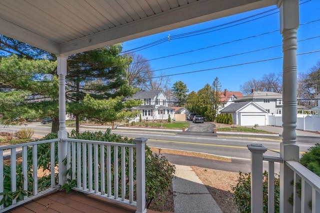 exterior space featuring a porch and a residential view