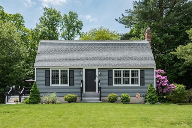 33 Cranberry Rd, Whitman, MA 02382 - dutch colonial featuring a chimney, a front lawn, roof with shingles, and a deck