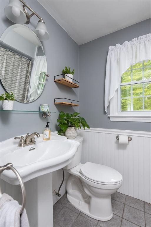 33 Cranberry Rd, Whitman, MA 02382 - bathroom with tile patterned floors, toilet, and wainscoting