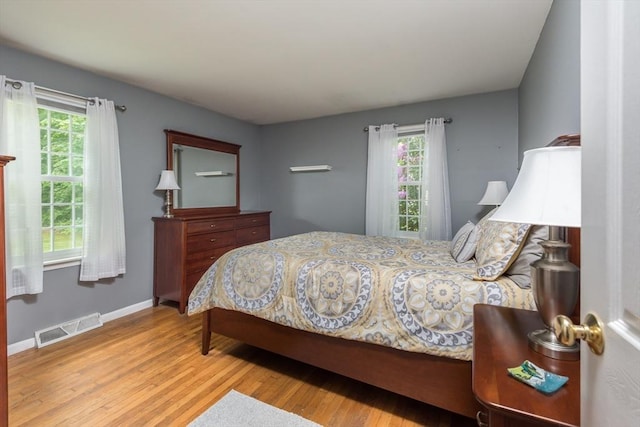 33 Cranberry Rd, Whitman, MA 02382 - bedroom featuring multiple windows, wood finished floors, and baseboards