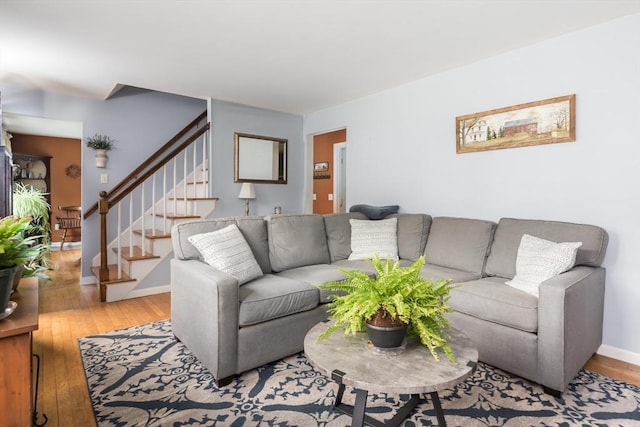 33 Cranberry Rd, Whitman, MA 02382 - living area with stairs, wood finished floors, and baseboards