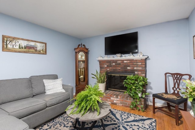 33 Cranberry Rd, Whitman, MA 02382 - living room with wood finished floors and a brick fireplace