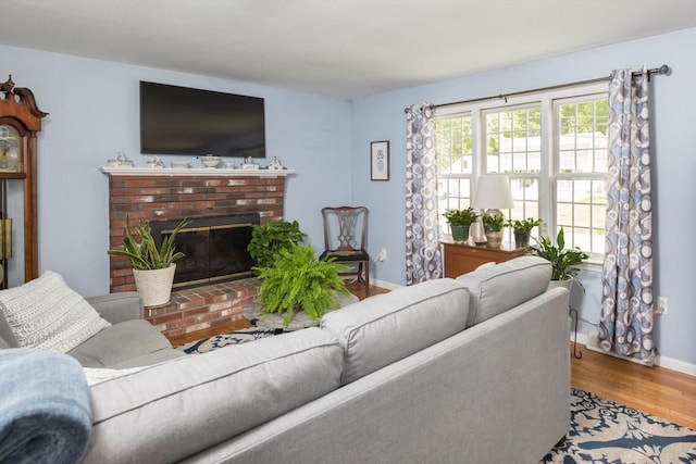 33 Cranberry Rd, Whitman, MA 02382 - living room featuring wood finished floors, a fireplace, and baseboards