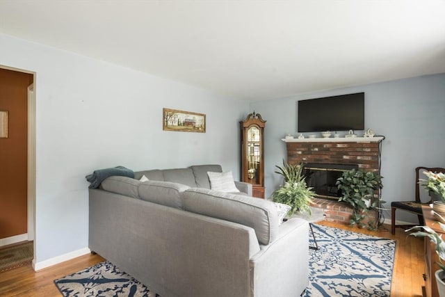 33 Cranberry Rd, Whitman, MA 02382 - living room featuring wood finished floors, baseboards, and a fireplace