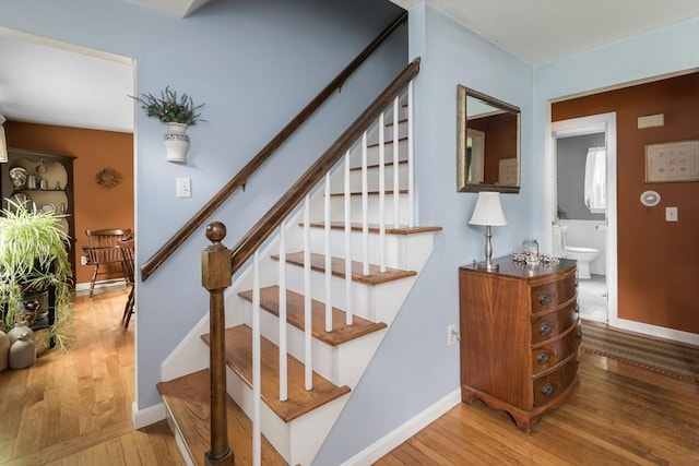 33 Cranberry Rd, Whitman, MA 02382 - staircase featuring hardwood / wood-style flooring and baseboards