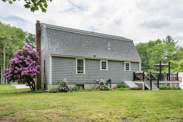 33 Cranberry Rd, Whitman, MA 02382 - rear view of property with a chimney, a wooden deck, a yard, and a shingled roof