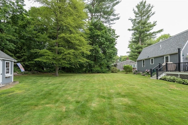 33 Cranberry Rd, Whitman, MA 02382 - view of green lawn with a wooden deck