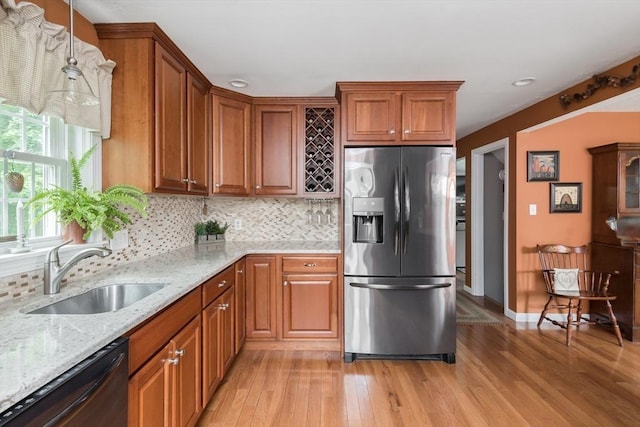 33 Cranberry Rd, Whitman, MA 02382 - kitchen with stainless steel fridge with ice dispenser, a sink, black dishwasher, light wood-type flooring, and backsplash