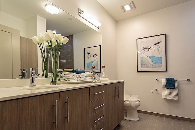 bathroom with vanity and toilet