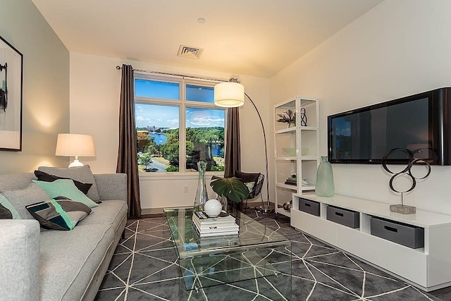 living room with dark tile patterned floors