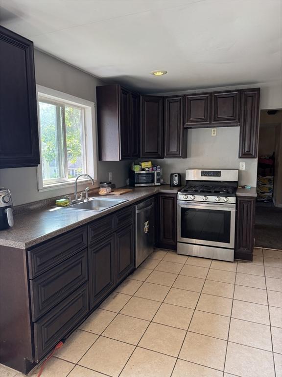 817 Middle St, Weymouth, MA 02188 - kitchen featuring appliances with stainless steel finishes, light tile patterned flooring, and recessed lighting