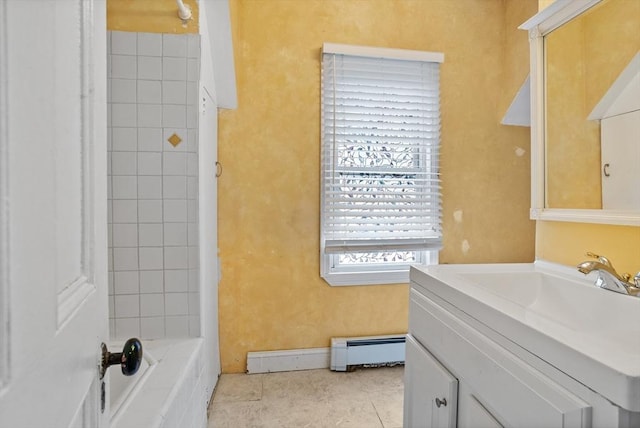 bathroom with a baseboard heating unit, a tub to relax in, tile patterned floors, vanity, and a shower