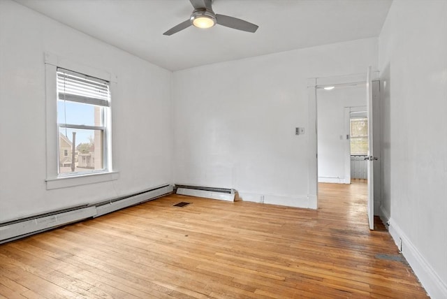 unfurnished room with light wood-style floors, plenty of natural light, and a ceiling fan