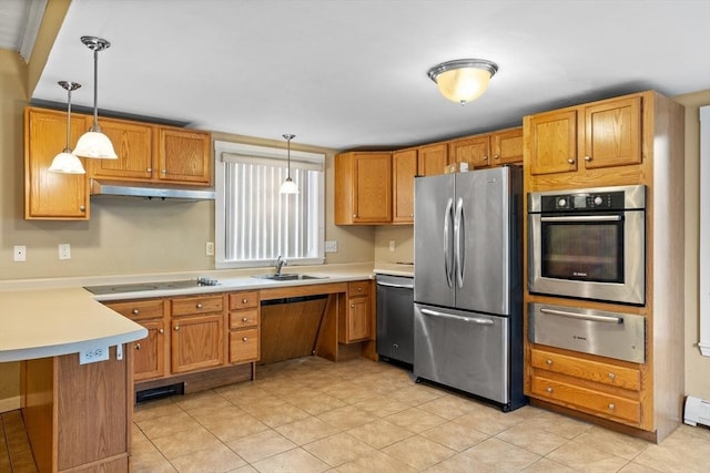 kitchen with appliances with stainless steel finishes, a warming drawer, a sink, under cabinet range hood, and light countertops