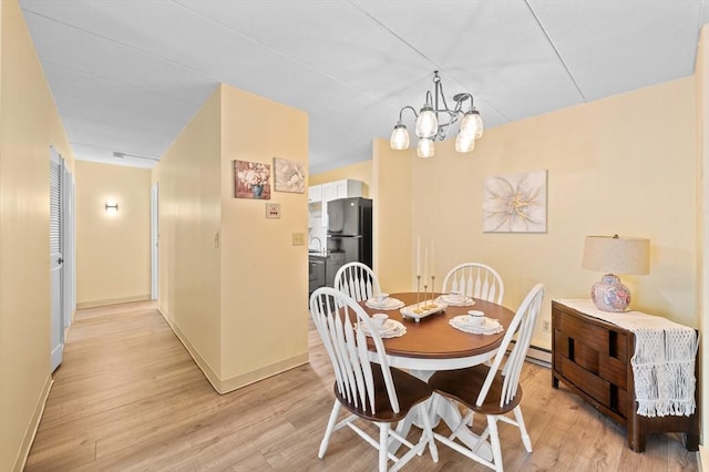 65 Commons Dr Unit 603, Shrewsbury, MA 01545 - dining space featuring light wood-style flooring and a chandelier