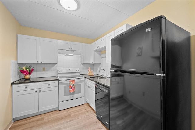65 Commons Dr Unit 603, Shrewsbury, MA 01545 - kitchen with black appliances, under cabinet range hood, dark countertops, and tasteful backsplash