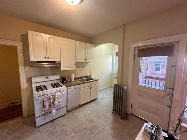 1269 Commonwealth Ave Unit 2, Boston, MA 02134 - kitchen with white appliances, radiator heating unit, under cabinet range hood, a sink, and arched walkways