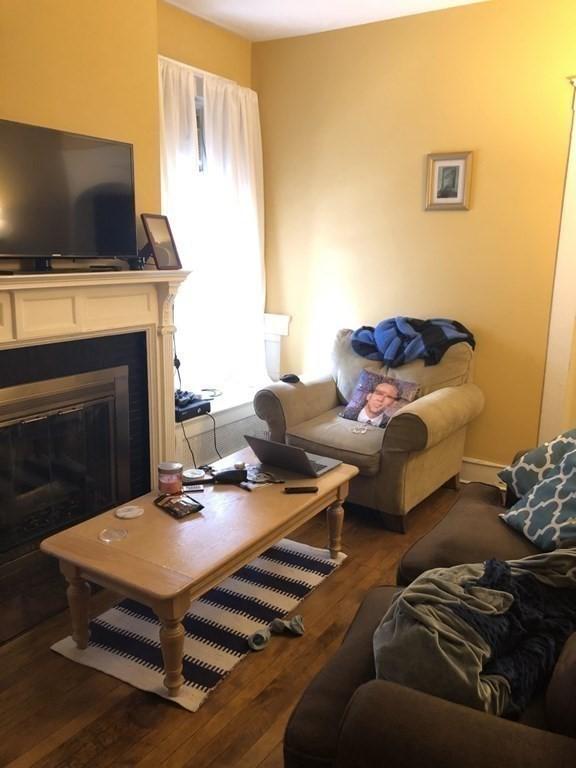 1269 Commonwealth Ave Unit 2, Boston, MA 02134 - living area featuring hardwood / wood-style flooring and a glass covered fireplace