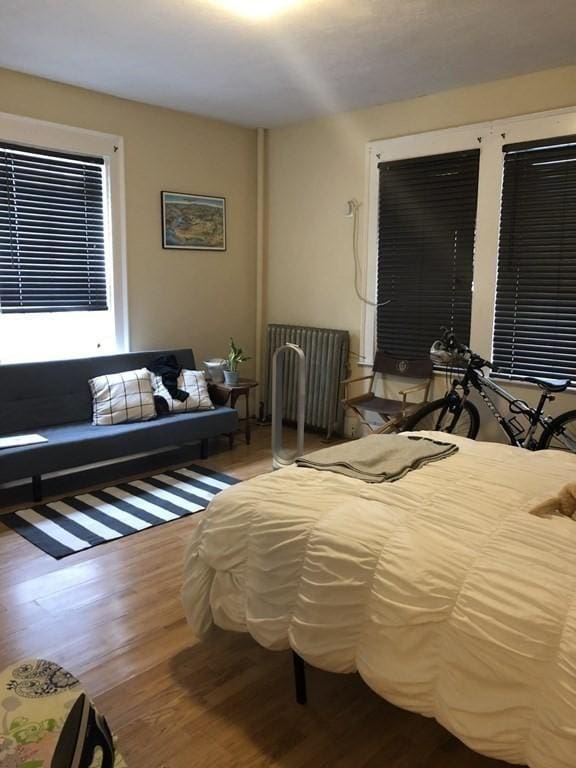1269 Commonwealth Ave Unit 2, Boston, MA 02134 - bedroom with wood finished floors and radiator