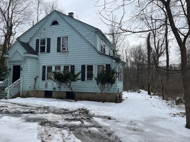 view of front of home featuring a chimney