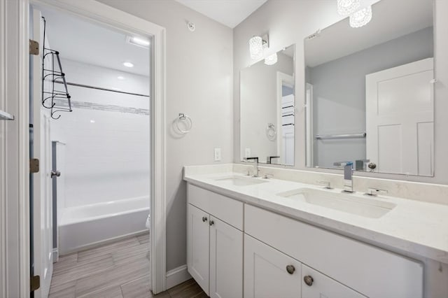 33 Oval Rd Unit 2, Quincy, MA 02170 - full bathroom with double vanity, toilet, bathing tub / shower combination, and baseboards