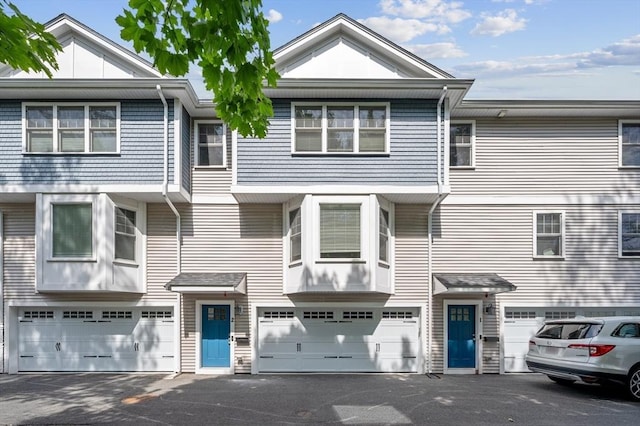 33 Oval Rd Unit 2, Quincy, MA 02170 - townhome / multi-family property with driveway and an attached garage