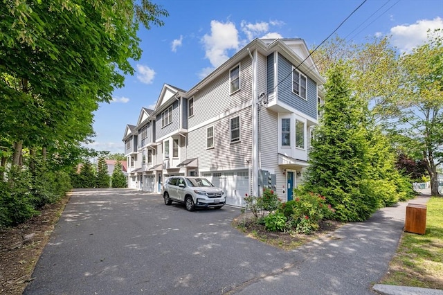 33 Oval Rd Unit 2, Quincy, MA 02170 - view of property with driveway and a garage