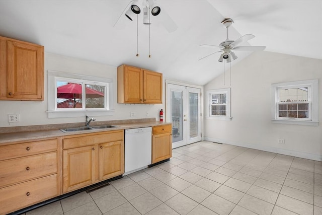 kitchen with dishwasher, vaulted ceiling, french doors, a ceiling fan, and a sink