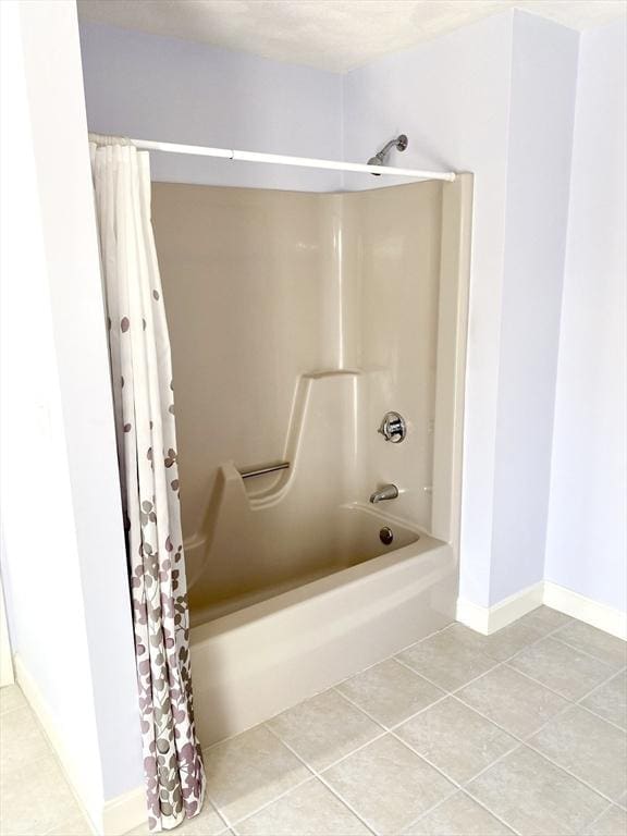 bathroom featuring tile patterned flooring and shower / tub combo