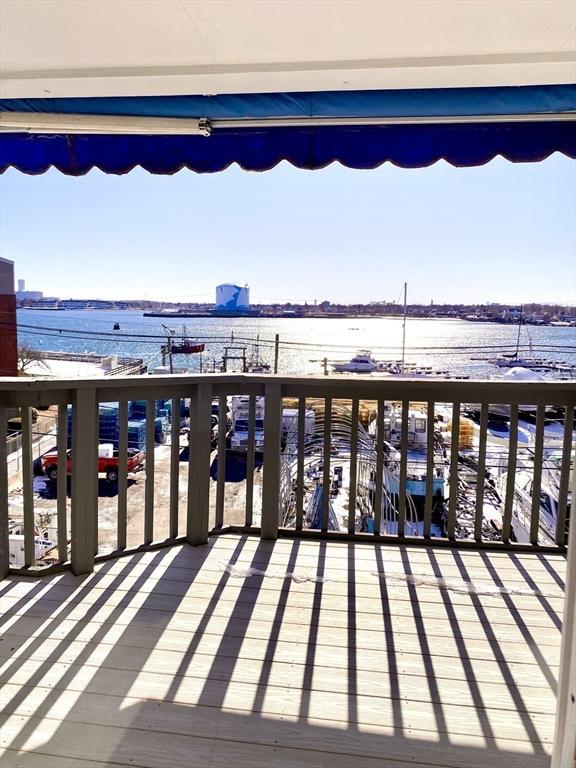 wooden terrace with a water view