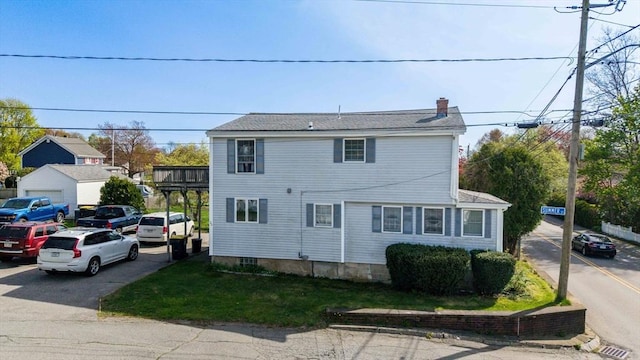 view of home's exterior featuring a chimney