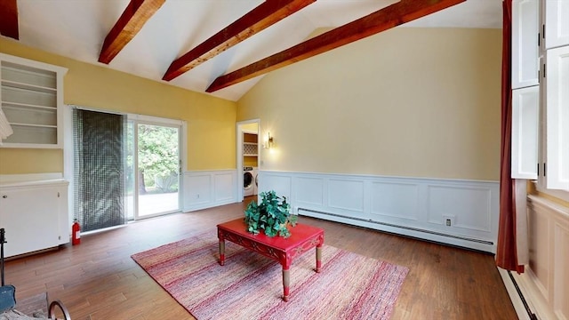 1 Ridgeway Rd, North Reading, MA 01864 - living room with a baseboard heating unit, washer / clothes dryer, wood finished floors, a wainscoted wall, and a decorative wall