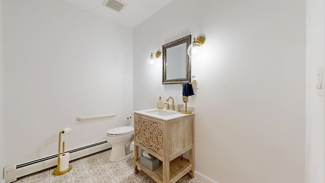 1 Ridgeway Rd, North Reading, MA 01864 - half bathroom with baseboard heating, vanity, and tile patterned floors