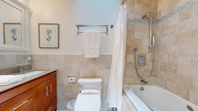 1 Ridgeway Rd, North Reading, MA 01864 - full bathroom featuring tiled shower / bath, vanity, tile walls, and a wainscoted wall