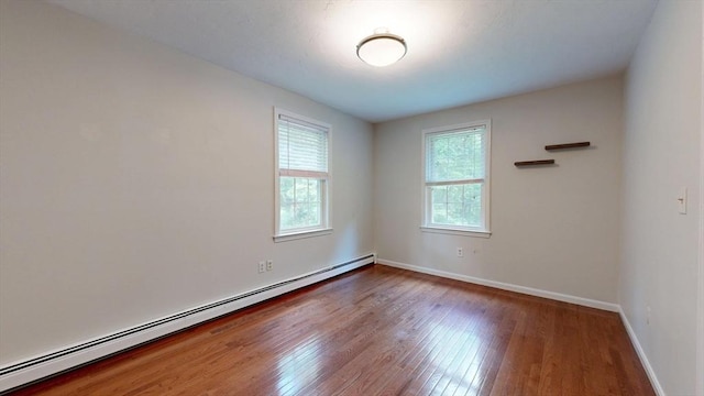 1 Ridgeway Rd, North Reading, MA 01864 - spare room featuring baseboard heating and wood finished floors