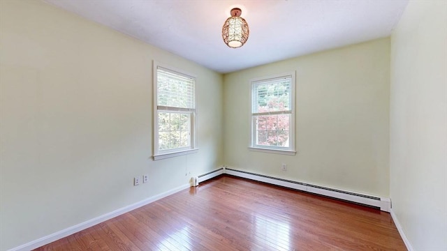 1 Ridgeway Rd, North Reading, MA 01864 - spare room featuring a baseboard radiator and hardwood / wood-style floors