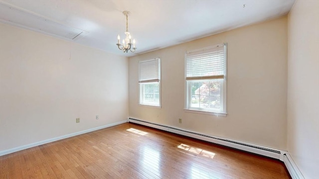 1 Ridgeway Rd, North Reading, MA 01864 - unfurnished room featuring baseboard heating, light wood-style floors, a chandelier, and attic access
